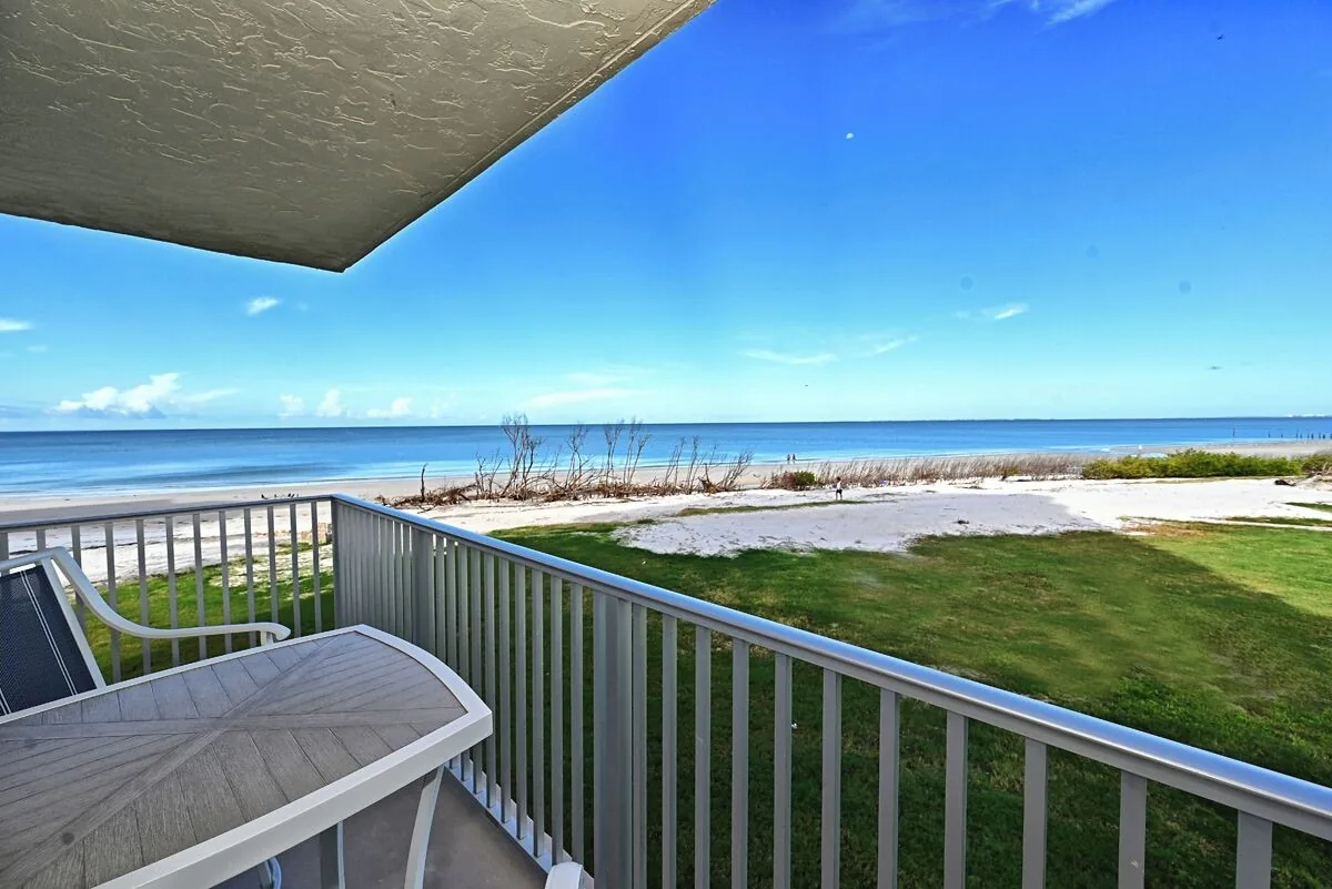 Private balcony view of the beach and Gulf of Mexico at Beachfront Haven