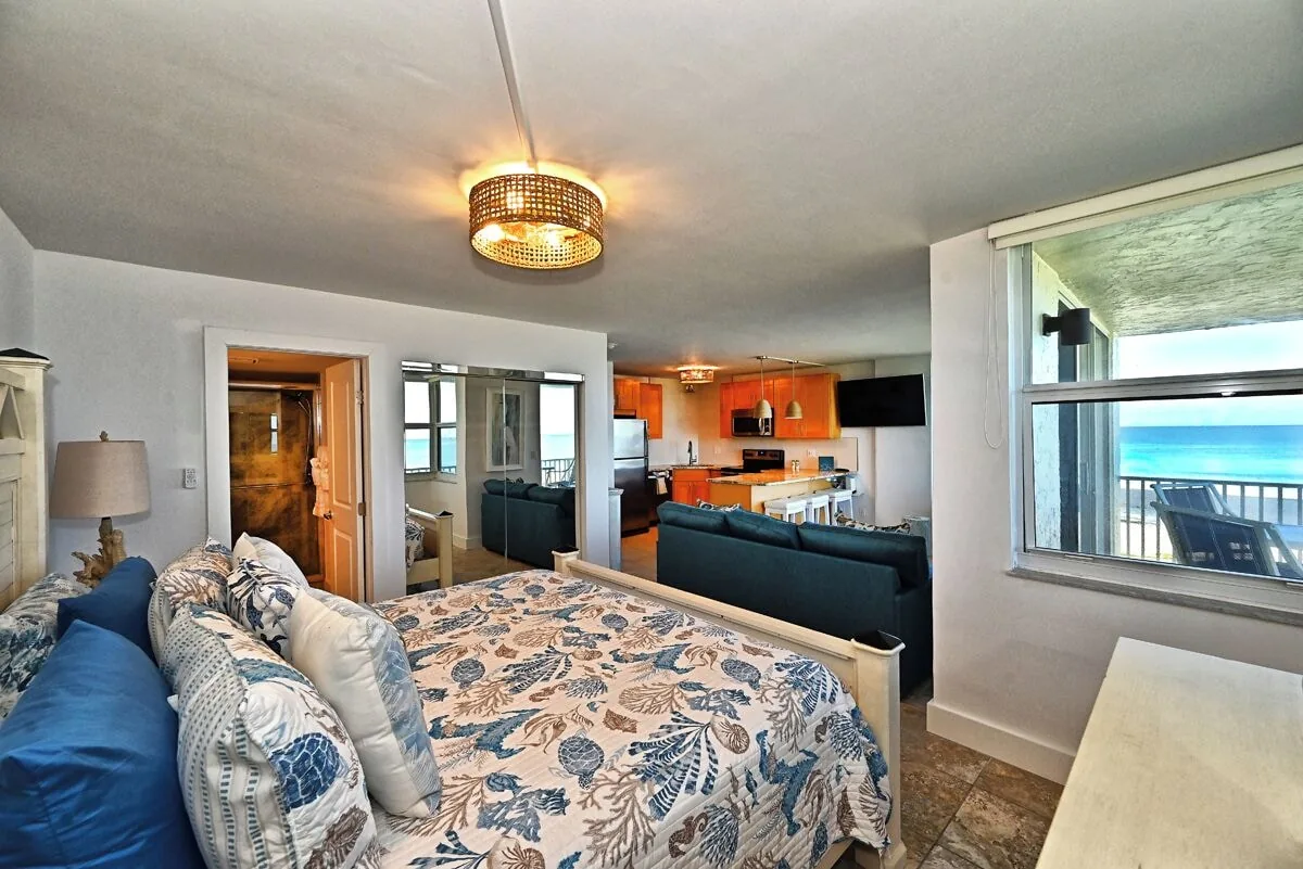 Bedroom with ocean-view window at Beachfront Haven