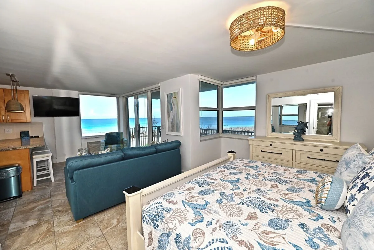 Bedroom with sofa and sea view at Beachfront Haven