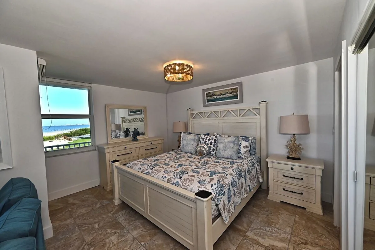 Bedroom with window view at Beachfront Haven condo